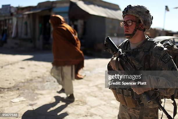 Army soldier Spc. Ryan Reeves of Pittsburg, Kansas with the 3rd Battalion, 509th Parachute Infantry Division walks on a patrol January 10, 2010 in...