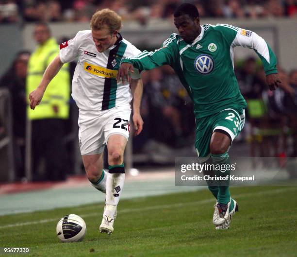 Grafite of Wolfsburg tackles Tobias Levels of Moenchengladbach during the Wintercup match between Borussia Moenchengladbach and VfL Wolfsburg at the...