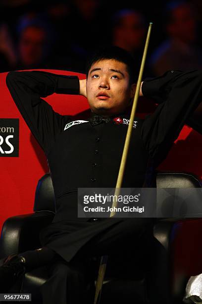 Ding Junhui of China looks dejected during his match against Mark Selby of England in the PokerStars.com Masters Snooker tournament at Wembley Arena...