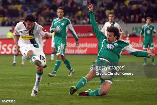 Raúl Marcelo Bobadilla of Moenchengladbach scores his second and the decision goal against Andrea Barzagli of Wolfsburg during the Wintercup match...