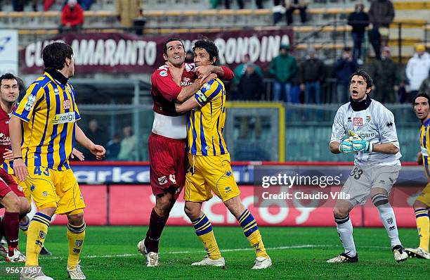Cristiano Lucarelli of AS Livorno Calcio grapples with Massimo Paci of Parma FC during the Serie A match between Livorno and Parma at Stadio Armando...