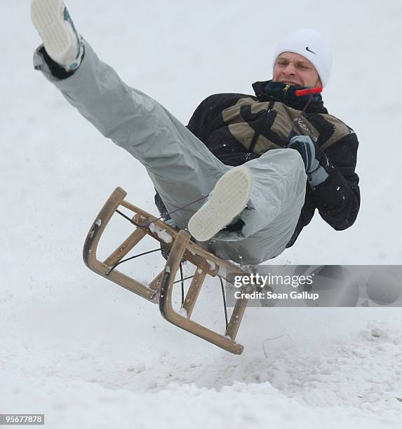 Man catches air as he sleds down a hill in Zehlendorf district on January 10, 2010 in Berlin, Germany. A blizzard has swept across Germany and left...