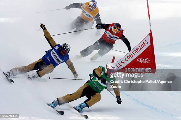 Xavier Kuhn of France takes 1st place and Tomas Kraus of the Czech Republic takes 3rd place during the FIS Freestyle World Cup Men's Ski Cross on...