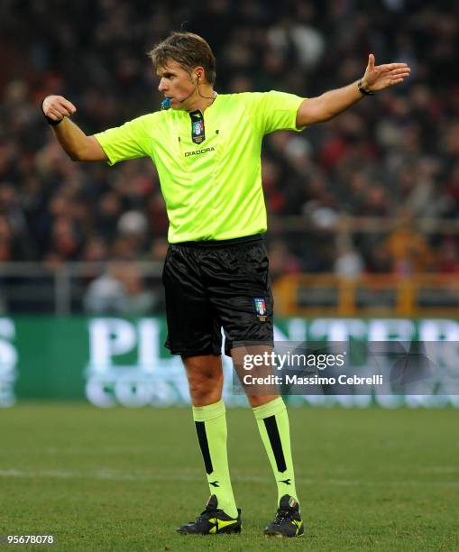 Referee Roberto Rosetti signals during the Serie A match between Genoa CFC and Catania Calcio at Stadio Luigi Ferraris on January 10, 2010 in Genoa,...