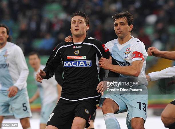 Andrea Coda of Udinese competes with Sebastiano Siviglia of Lazio during the Serie A match between Udinese and Lazio at Stadio Friuli on January 10,...