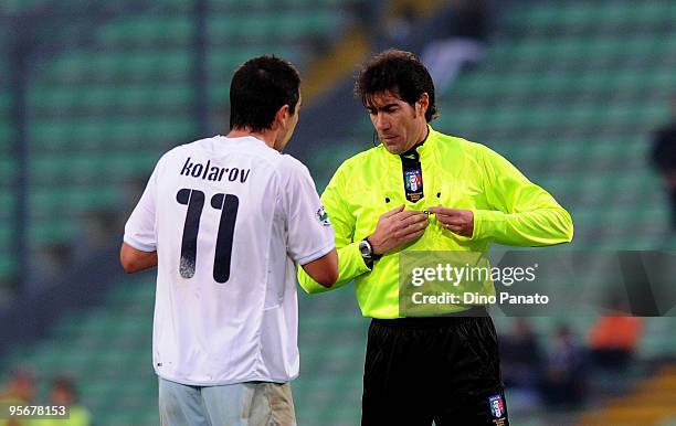 Referee Mauro Bergonzi shows a yellow card to Aleksandar Kolarov of Lazio during the Serie A match between Udinese and Lazio at Stadio Friuli on...