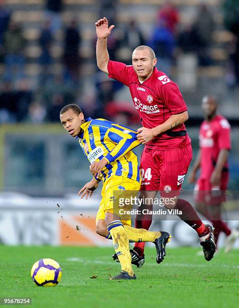 Mozart of AS Livorno Calcio competes for the ball with Jonathan Biabiany of Parma FC during the Serie A match between Livorno and Parma at Stadio...