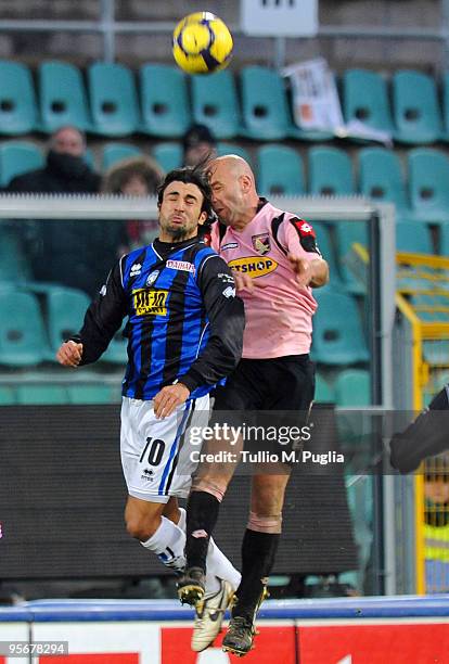 Giovanni Ceravolo of Atalanta and Giulio Migliaccio of Palermo compete for a header during the Serie A match between US Citta di Palermo and Atalanta...