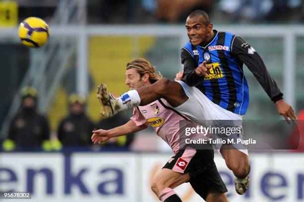 Federico Balzaretti of Palermo and Ferreira Pinto of Atalanta compete for the ball during the Serie A match between US Citta di Palermo and Atalanta...