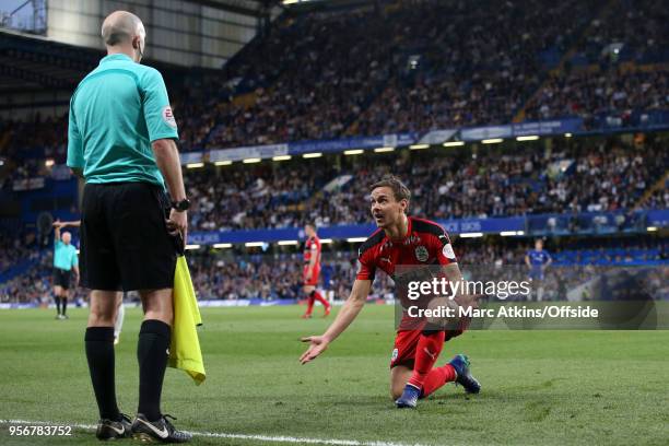 Chris Lowe of Huddersfield Town complains to the linesman during the Premier League match between Chelsea and Huddersfield Town at Stamford Bridge on...