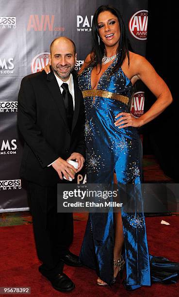 Comedian Dave Attell and adult film actress Angela Aspen arrive at the 27th annual Adult Video News Awards Show at the Palms Casino Resort January 9,...