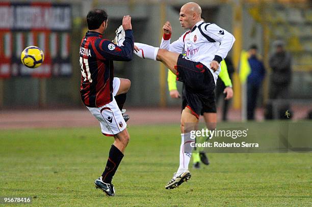 Andrea Parola of Cagliari competes for the ball with Massimo Marazzina of Bologna during the Serie A match between Bologna and Cagliari at Stadio...