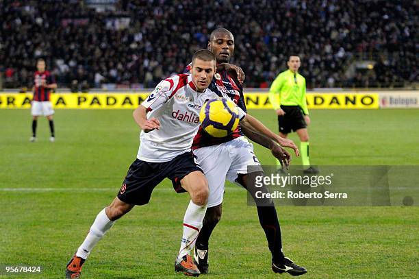 Daniele Dessena of Cagliari competes for the ball with Marcelo Danubio Zalayeta of Bologna during the Serie A match between Bologna and Cagliari at...