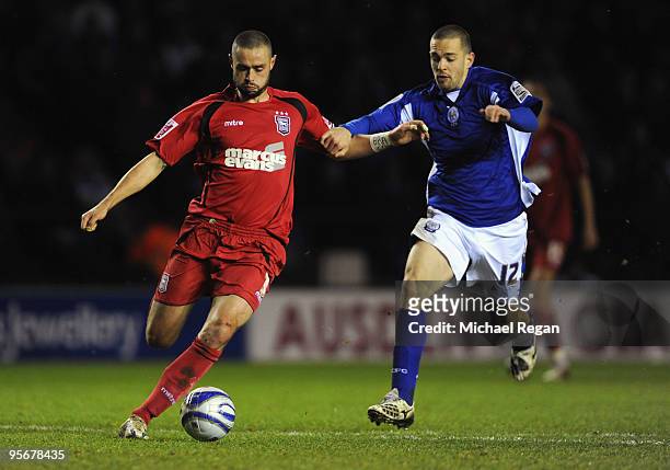 Matt Fryatt of Leicester battles with Damien Delaney of Ipswich during the Coca-Cola Championship match between Leicester City and Ipswich Town at...