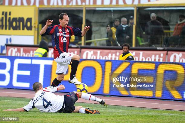 Daniele Dessena of Cagliari competes for the ball with Martins Bolzan Adailton of Bologna during the Serie A match between Bologna and Cagliari at...