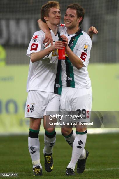 Fabian Baecker of Moenchengladbach, who scored the decision goal celebrates the 1-0 victory with Marco Reus after the Wintercup final match between...