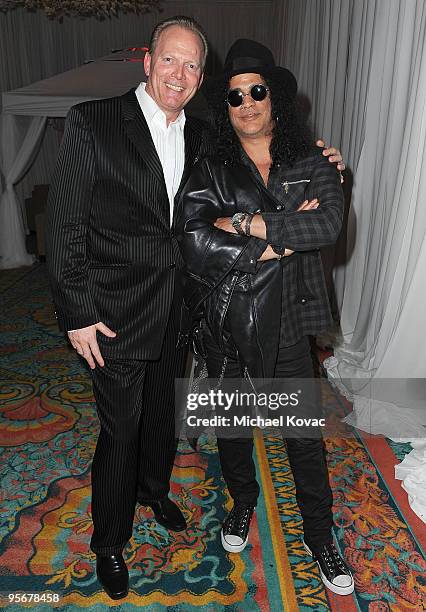 Team PokerStars Pro Marcel Luske and musician Slash attend the amfAR Cocktail Party & PokerStars Red Carpet and Party at Aura Nightclub on January 9,...