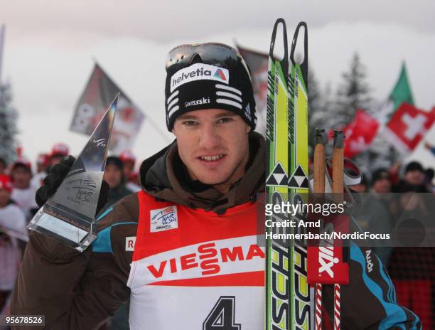 3rd Dario Cologna of Switzerland celebrates his success during the final climb men for the FIS Cross Country World Cup Tour de Ski on January 10,...