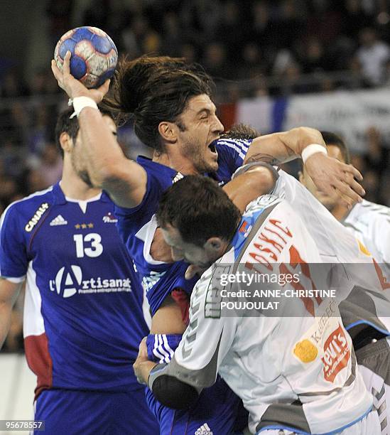 French Bertrand Gille tries to score against Serbian Alem Toskic during their handball friendly match France vs. Serbia, on January 10, 2010 at the...