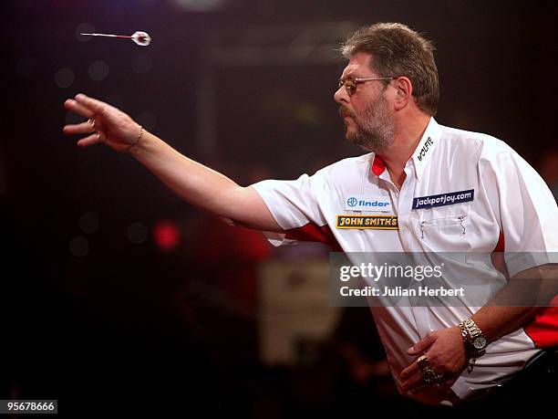 Martin Adams of England in action against Dave Chisnall of England during the Final of The World Professional Darts Championship at The Lakeside on...