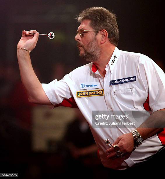 Martin Adams of England in action against Dave Chisnall of England during the Final of The World Professional Darts Championship at The Lakeside on...