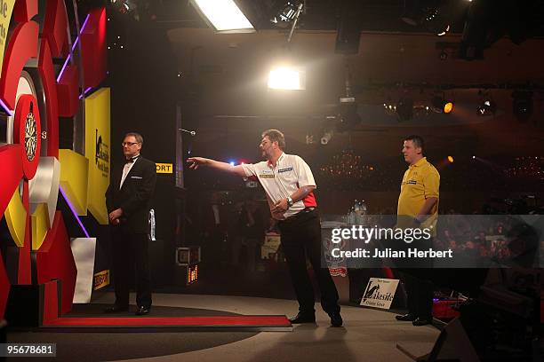 Martin Adams of England in action against Dave Chisnall of England during the Final of The World Professional Darts Championship at The Lakeside on...