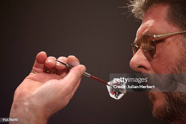 Martin Adams of England in action against Dave Chisnall of England during the Final of The World Professional Darts Championship at The Lakeside on...