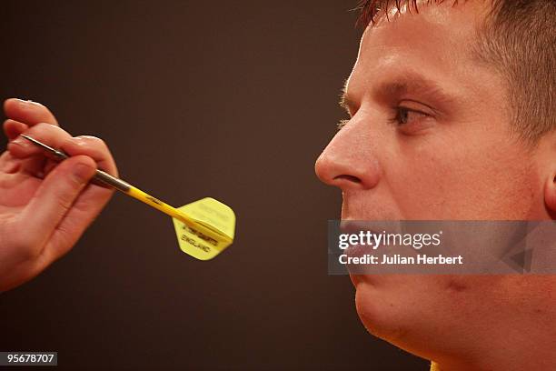 Dave Chisnall of England in action against Martin Adams of England during the Final of The World Professional Darts Championship at The Lakeside on...