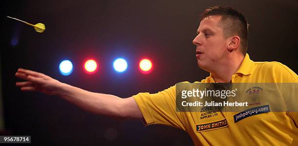 Dave Chisnall of England in action against Martin Adams of England during the Final of The World Professional Darts Championship at The Lakeside on...
