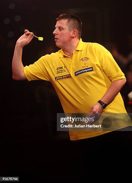 Dave Chisnall of England in action against Martin Adams of England during the Final of The World Professional Darts Championship at The Lakeside on...