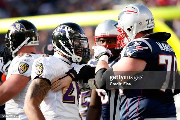 Logan Mankins of the New England Patriots and Ed Reed of the Baltimore Ravens get in each others face during the 2010 AFC wild-card playoff game at...