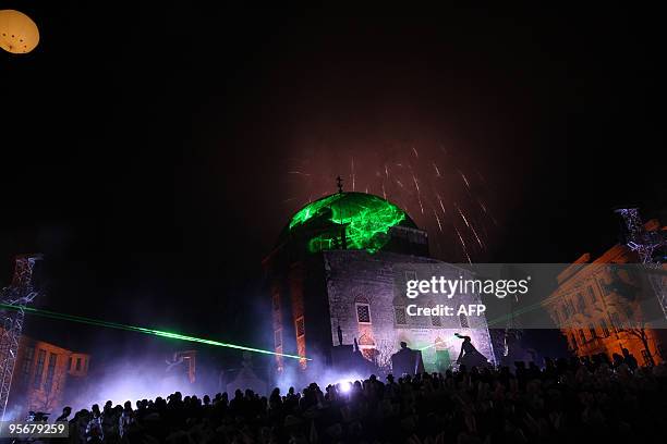 Fireworks explode over the main square of Pecs downtown during the opening ceremony of the 'Pecs 2010' cultural capital event on January 10, 2010....