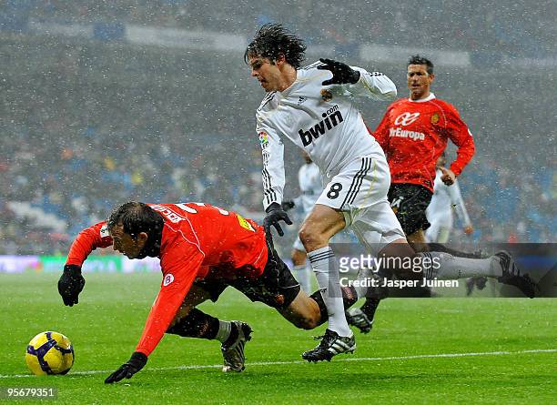 Kaka of Real Madrid duels for the ball with Jose Miguel Gonzalez of Mallorca during the La Liga match between Real Madrid and Mallorca at the Estadio...