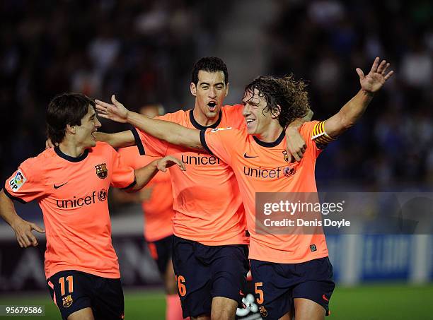 Carles Puyol of Barcelona celebrates with Sergio Busquets and Bojan Krkic after scoring Barcelona's second goal during the La Liga match between...