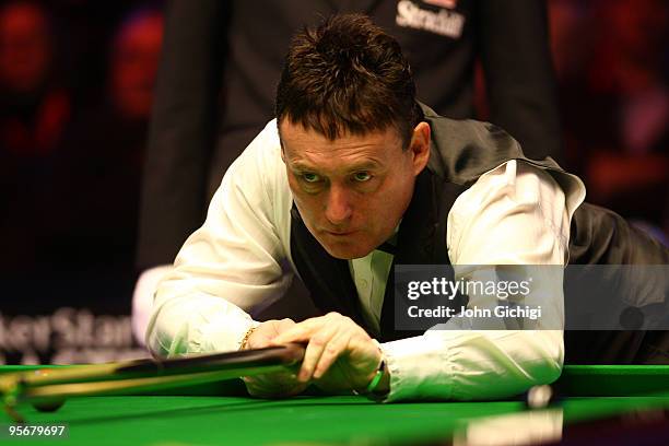 Jimmy White of England lines up a shot during his game against Mark King of England in the PokerStars.com Masters Snooker tournament at Wembley Arena...