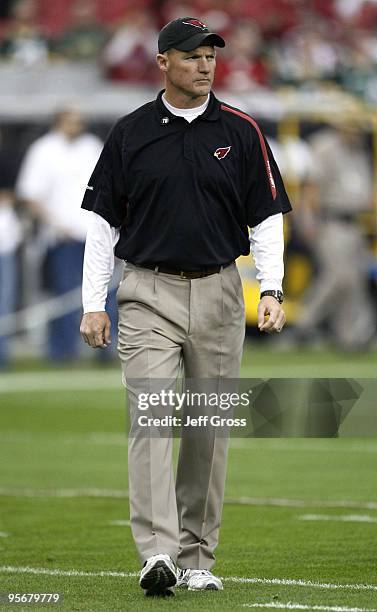 Head coach Ken Whisenhunt of the Arizona Cardinals walks on the field prior to the 2010 NFC wild-card playoff game against the Green Bay Packers at...