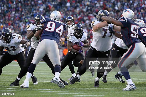 Willis McGahee of the Baltimore Ravens scores a 3-yard rushing touchdown in the fourth quarter against the New England Patriots during the 2010 AFC...