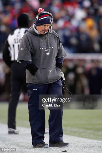 Head coach Bill Belichick of the New England Patriots stands on the sideline with his head down against the Baltimore Ravens during the 2010 AFC...