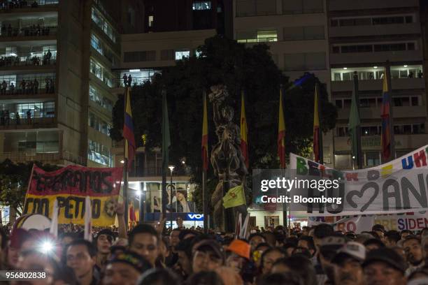Supporters of Gustavo Petro, presidential candidate for the Progressivists Movement Party, hold up banners during a campaign rally in Pereira,...