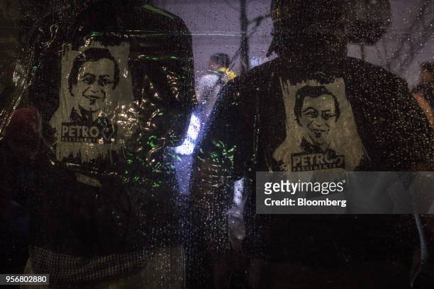 Supporters wear t shirts featuring the face of Gustavo Petro, presidential candidate for the Progressivists Movement Party, during a campaign rally...