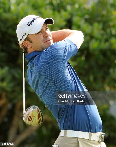Martin Laird of Scotland hits a drive from the first tee box during the final round of the SBS Championship at Plantation Course at Kapalua on...