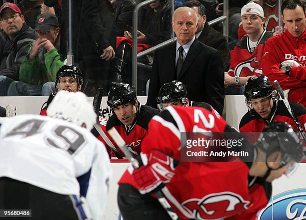Head Coach Jacques Lamaire of the New Jersey Devils eyes the action against the Tampa Bay Lightning during the continuation of the game from January...