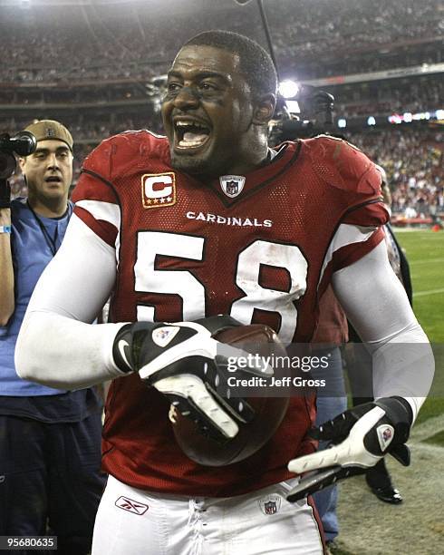 Linebacker Karlos Dansby of the Arizona Cardinals walks off the field after defeating the Green Bay Packers 51-45 in the 2010 NFC wild-card playoff...