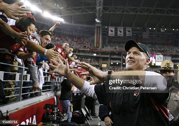 Head coach Ken Whisenhunt of the Arizona Cardinals celebrates after his team won the 2010 NFC wild-card playoff game 51-45 against the Green Bay...