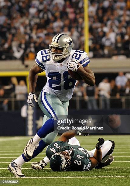 Running back Felix Jones of the Dallas Cowboys runs the ball past Sheldon Brown of the Philadelphia Eagles during the 2010 NFC wild-card playoff game...