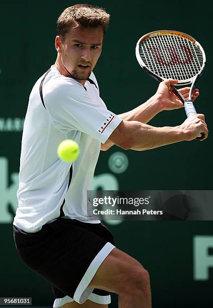 Marco Chiudinelli of Switzerland plays a backhand during his first round match against Thomaz Bellucci of Brazil at ASB Tennis Centre on January 11,...