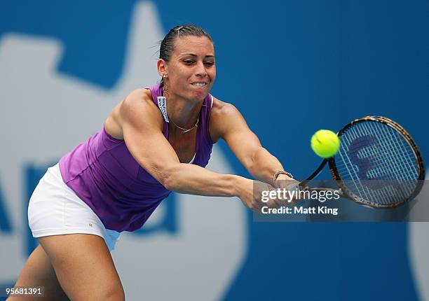Flavia Pennetta of Italy plays a backhand in her first round match against Samantha Stosur of Australia during day two of the 2010 Medibank...