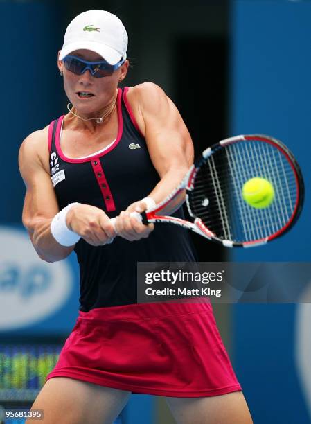 Samantha Stosur of Australia plays a backhand in her first round match against Flavia Pennetta of Italy during day two of the 2010 Medibank...