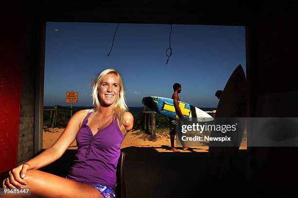 Bethany Hamilton of Hawaii, who lost her arm in a shark attack when aged 13, poses at North Narabeen Beach on January 10, 2010 in Sydney, Australia.