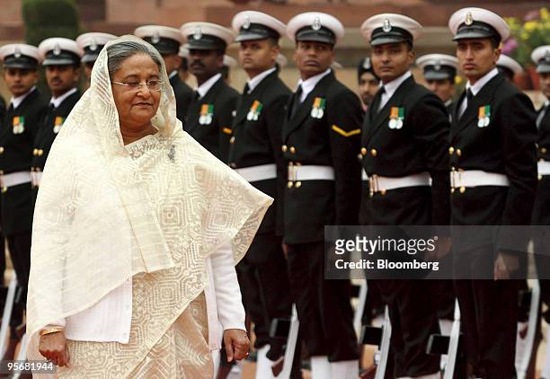 Sheikh Hasina Wajed, Bangladesh's prime minister, inspects an honor guard upon her arrival to the Indian presidential palace in New Delhi, India, on...